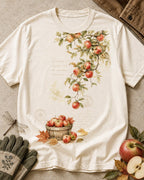 Women's off white cotton T-shirt with apple branches and a harvest basket, front view.
