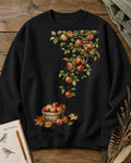 Women's black crewneck sweatshirt with apple branches and a harvest basket, front view.