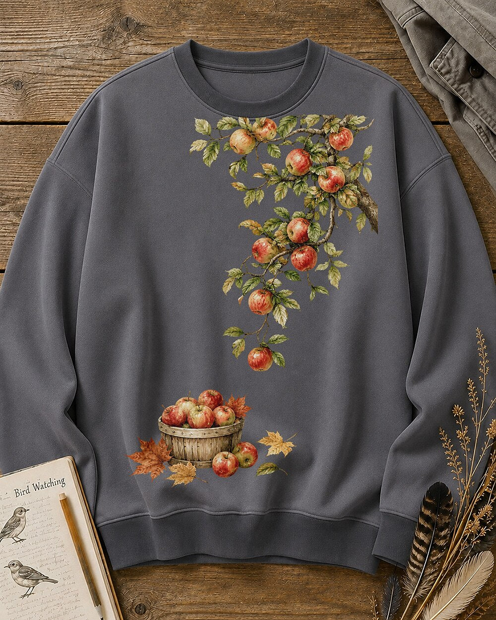 Women's gray crewneck sweatshirt with apple branches and a harvest basket, front view.