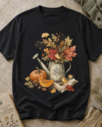 Women's black cotton T-shirt with an autumn bouquet in a watering can with pumpkins, front view.