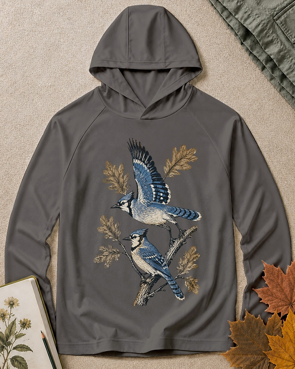 Women's dark gray sun hoodie with blue jays perched on oak branches, front view.