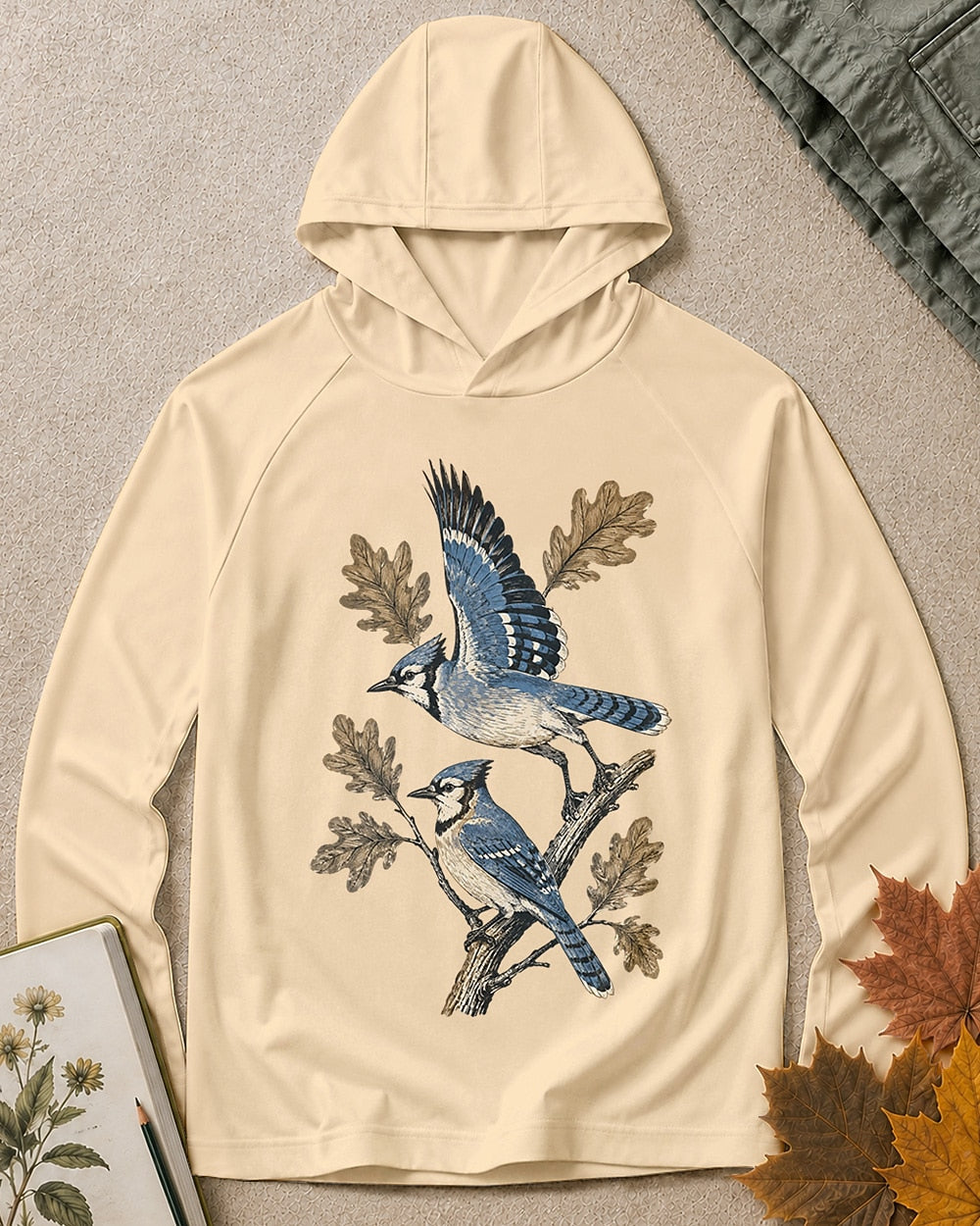 Women's light yellow sun hoodie with blue jays perched on oak branches, front view.