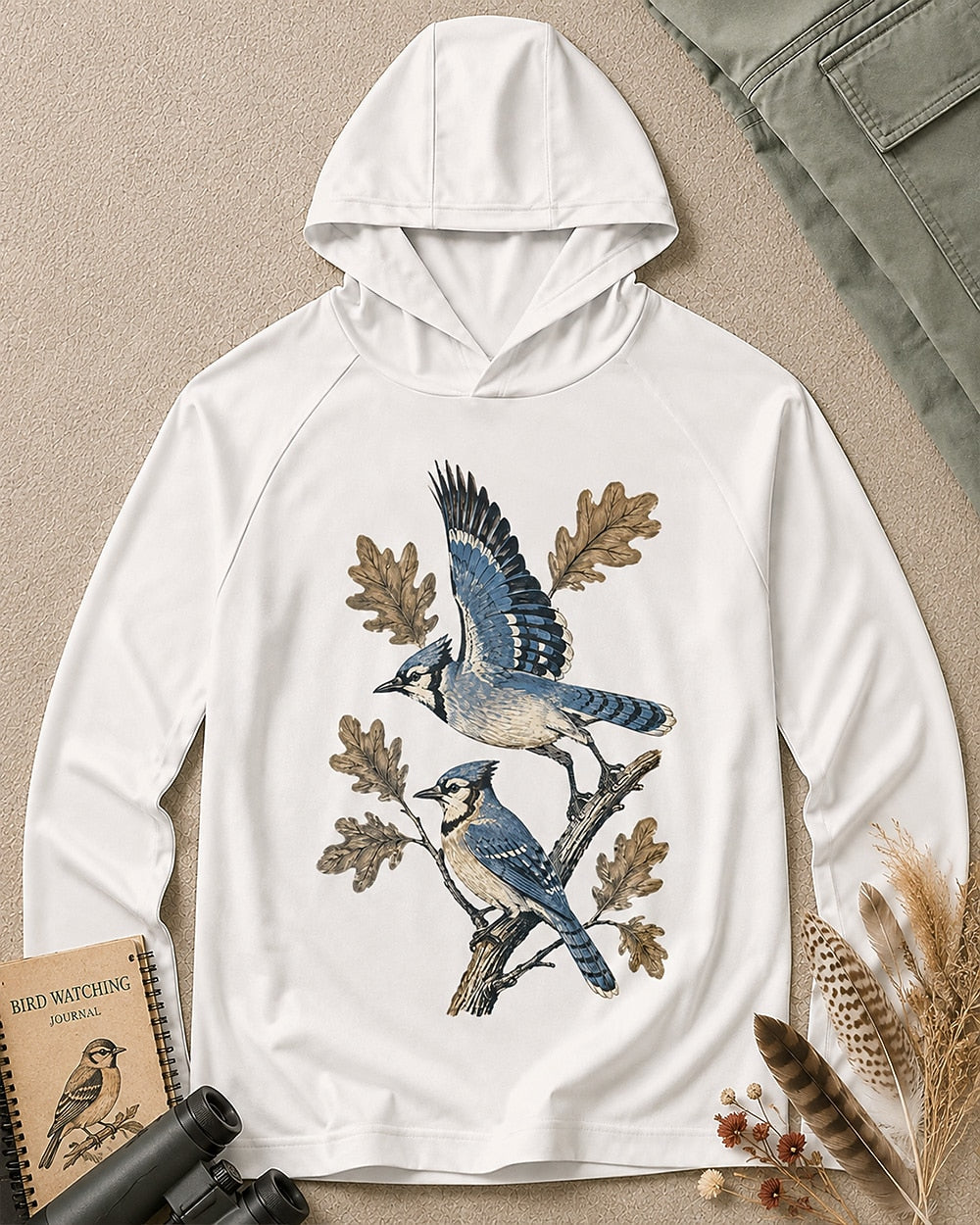 Women's white sun hoodie with blue jays perched on oak branches, front view.