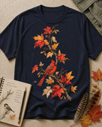 Women's dark navy cotton T-shirt with a cardinal among orange autumn leaves, front view.