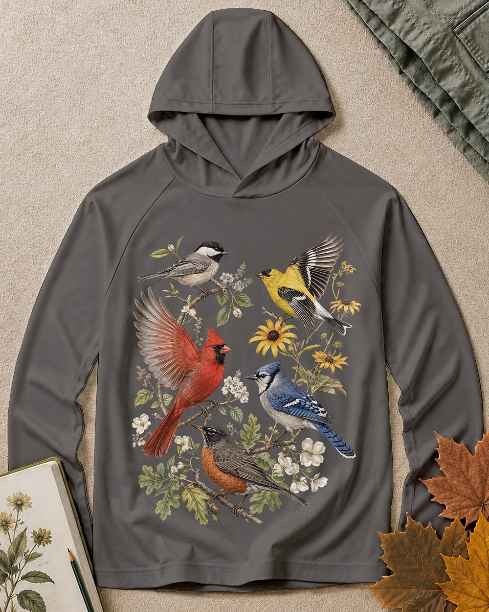 Women's dark gray sun hoodie with cardinals, blue jays, goldfinches and flowers, front view.