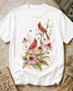 Women's white cotton T-shirt with cardinals among pink coneflowers, front view.