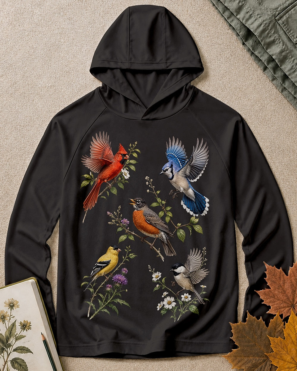 Women's black sun hoodie with cardinals, robins and other backyard birds, front view.