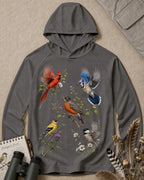 Women's dark gray sun hoodie with cardinals, robins and other backyard birds, front view.
