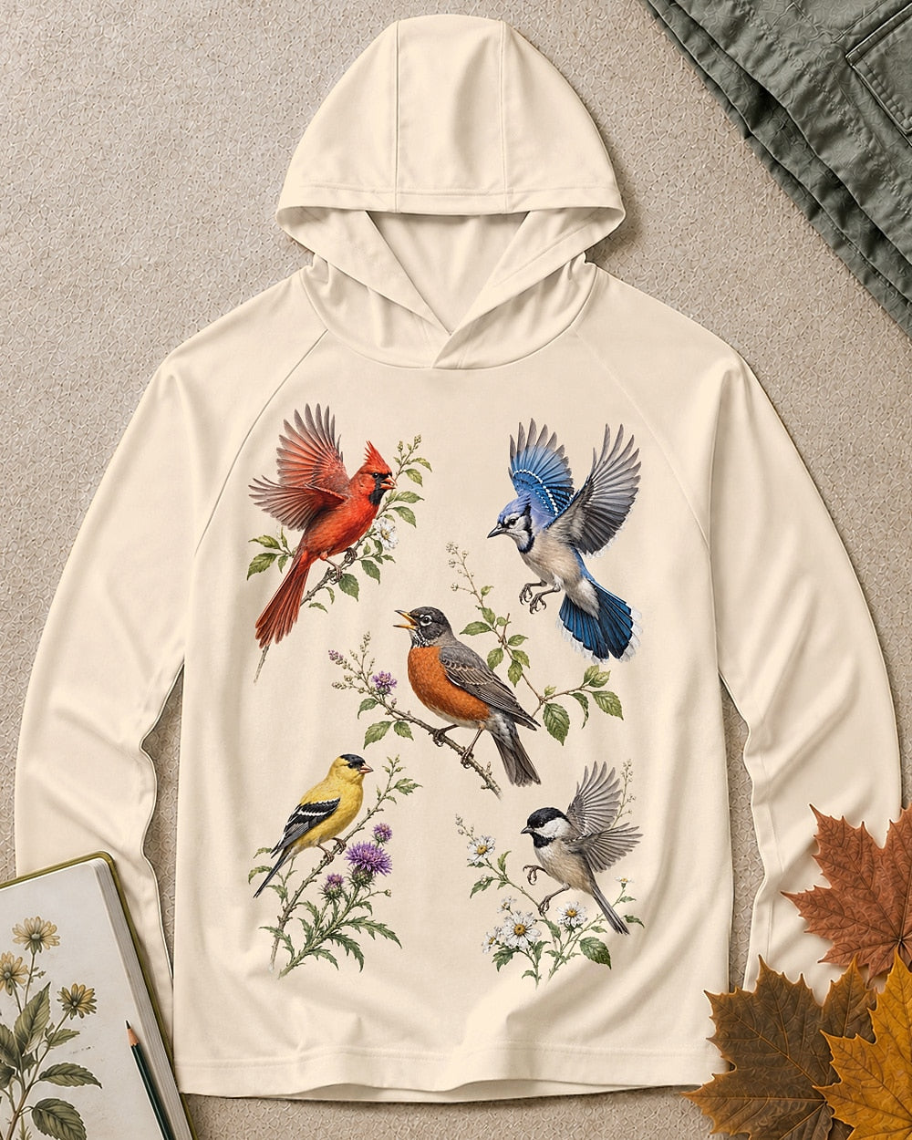 Women's light yellow sun hoodie with cardinals, robins and other backyard birds, front view.
