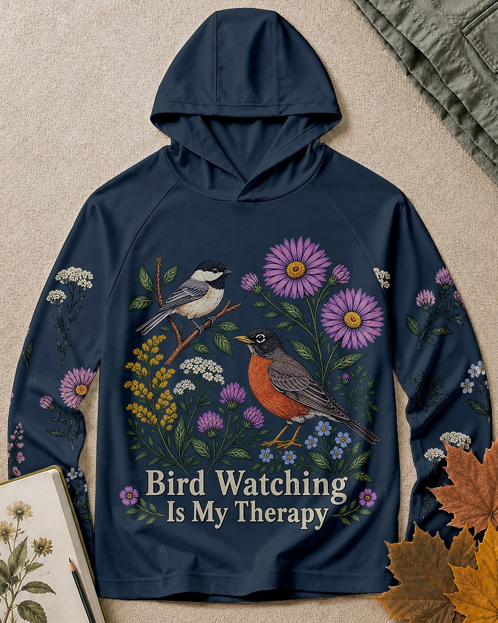 Women's dark navy sun hoodie with a chickadee, robin and wildflowers, front view.