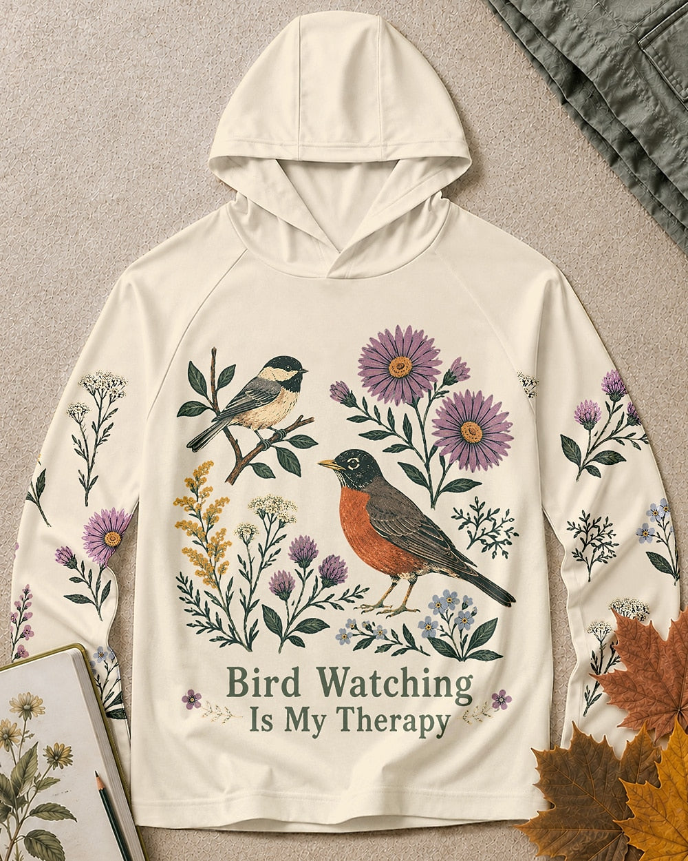 Women's white sun hoodie with a chickadee, robin and wildflowers, front view.