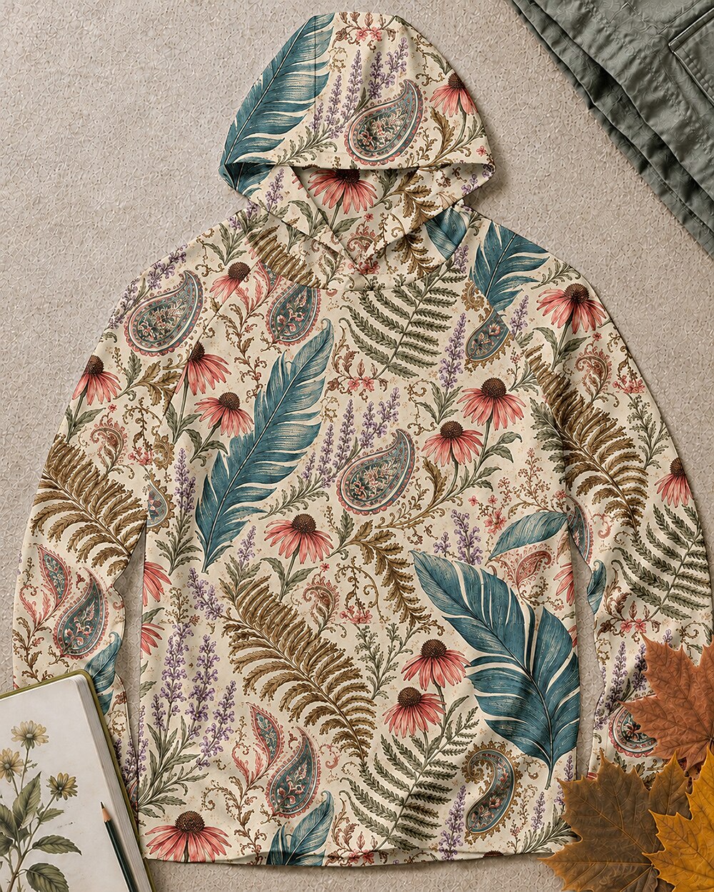 Women's blue sun hoodie with an all-over coneflower and paisley pattern, front view.