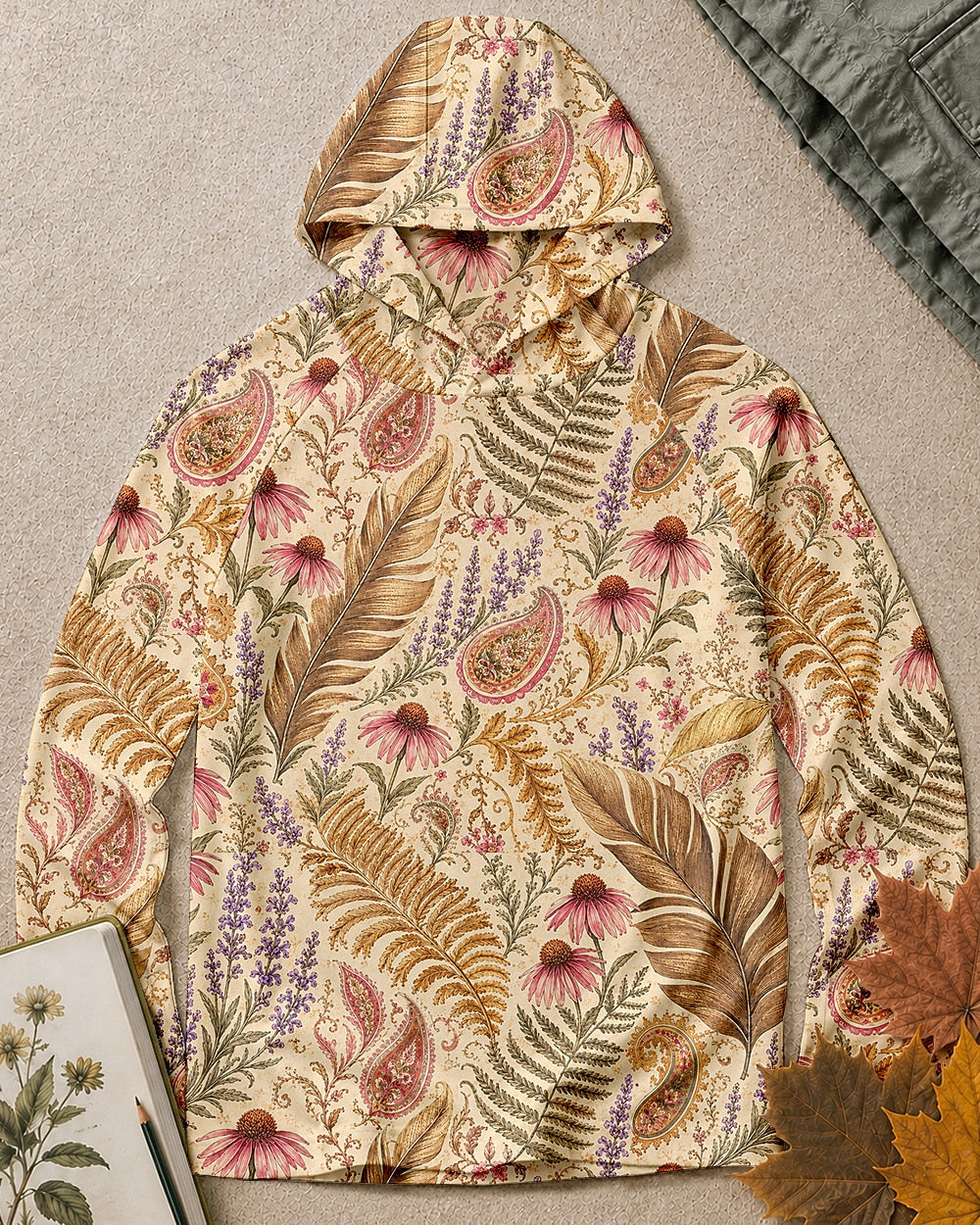 Women's yellow sun hoodie with an all-over coneflower and paisley pattern, front view.