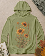 Women's green sun hoodie with yellow coneflowers and wheat, front view.