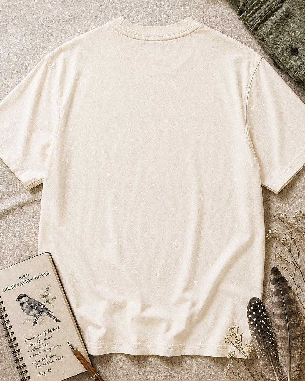Back view of the women's beige cotton T-shirt, showing the plain back and crew neckline.
