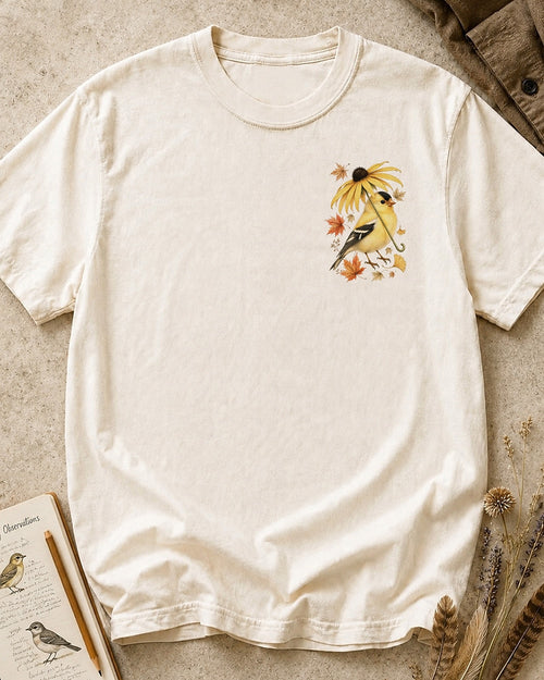 Women's beige cotton T-shirt with a small goldfinch and flower chest print, front view.