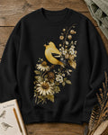 Women's black crewneck sweatshirt with a goldfinch among yellow flowers, front view.