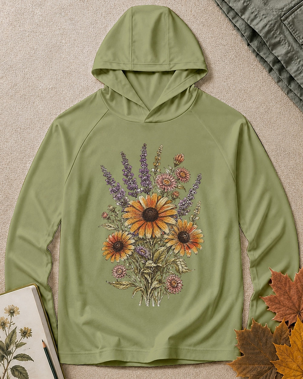 Women's green sun hoodie with lavender and yellow coneflowers, front view.