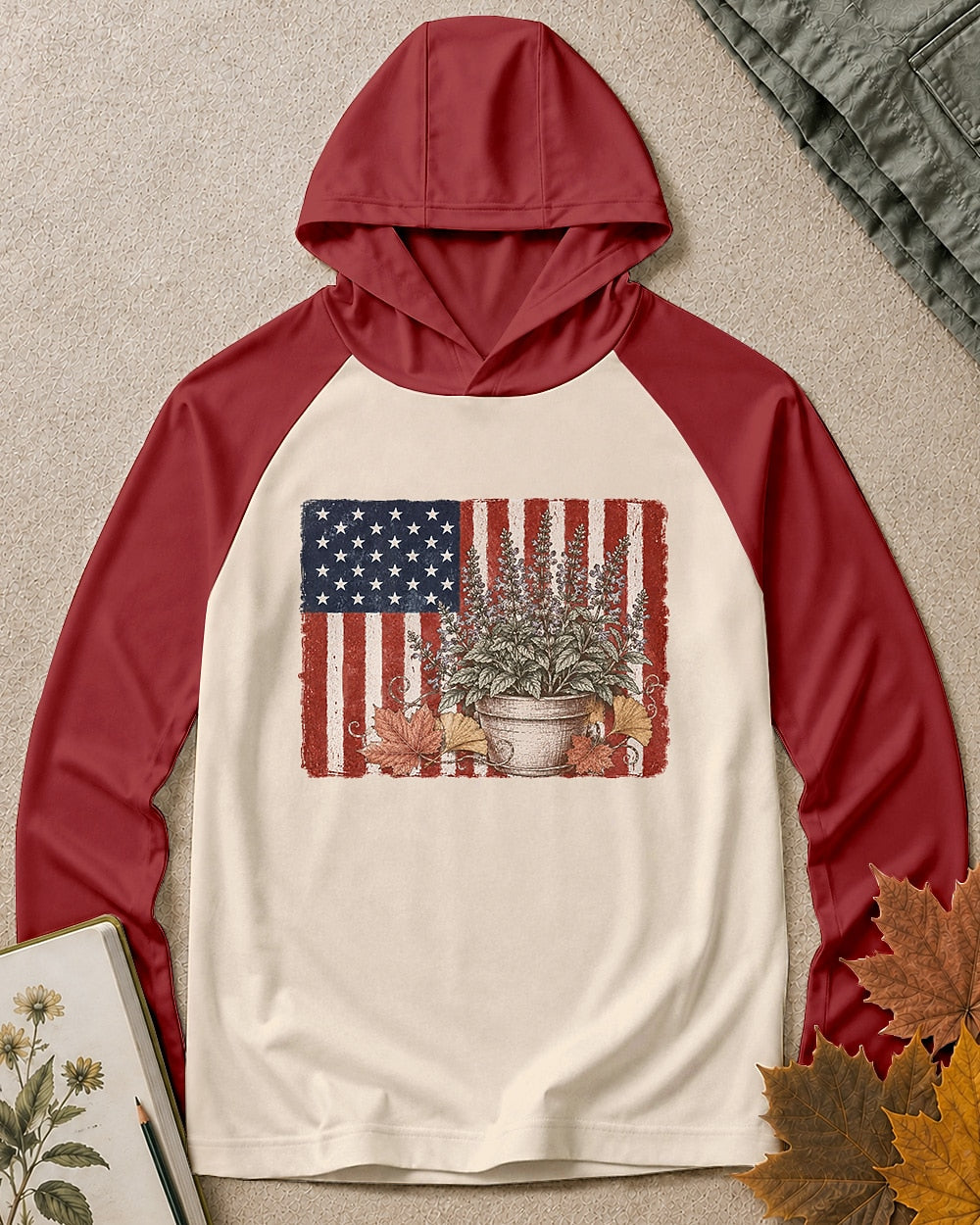 Women's red cream sun hoodie with potted herbs and an American flag, front view.