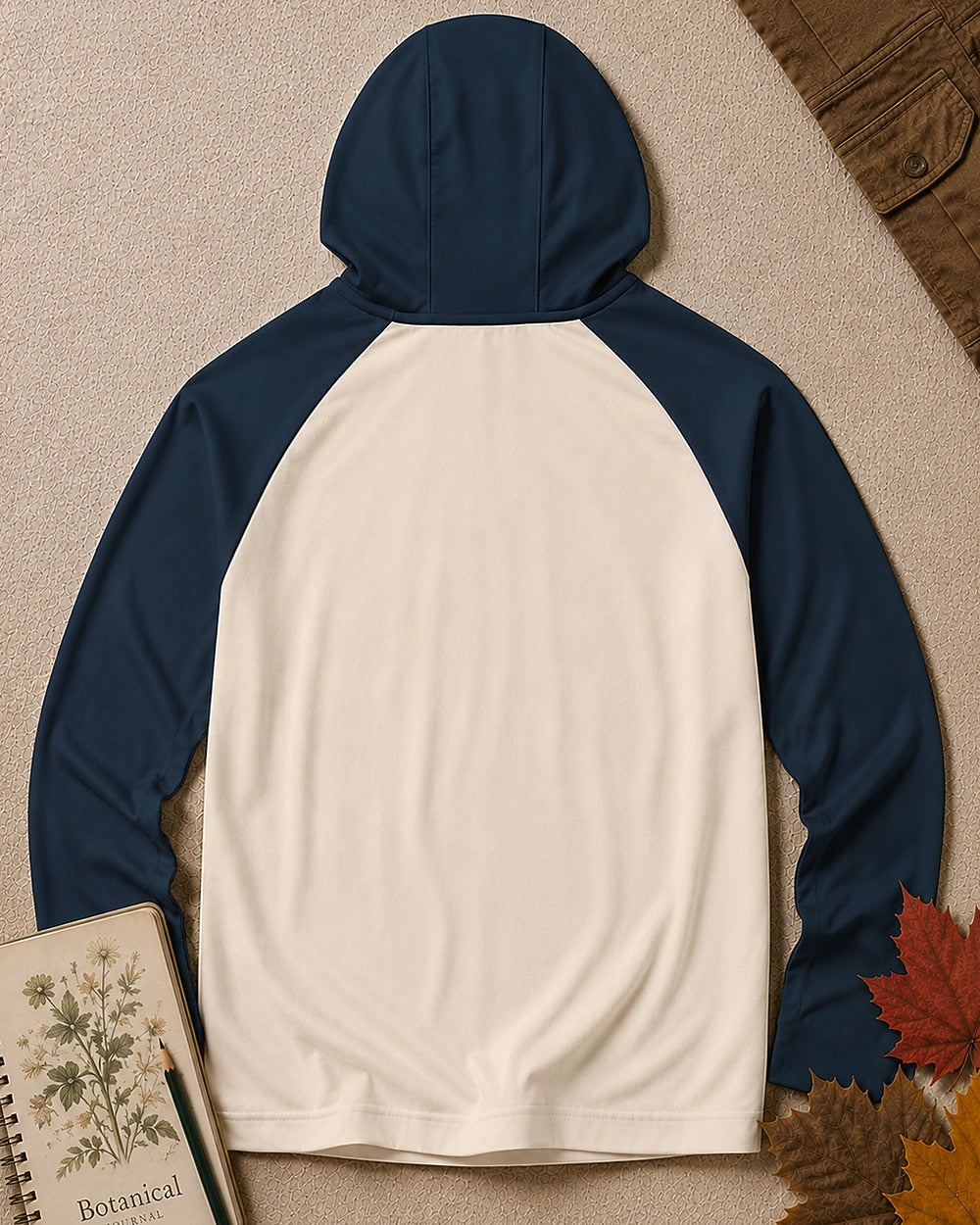 Back view of the women's navy cream sun hoodie, showing the hood and long sleeves.