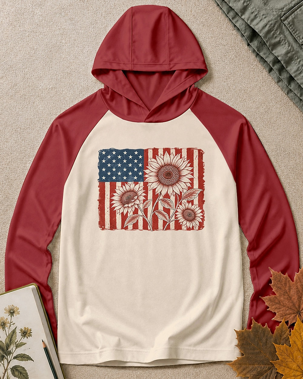 Women's red cream sun hoodie with red sunflowers and an American flag, front view.