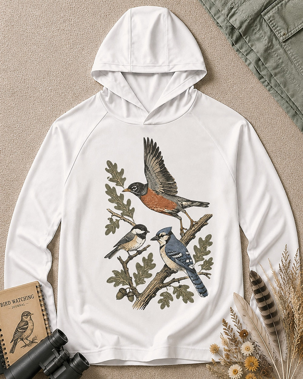Women's white sun hoodie with a flying robin and blue jay among branches, front view.