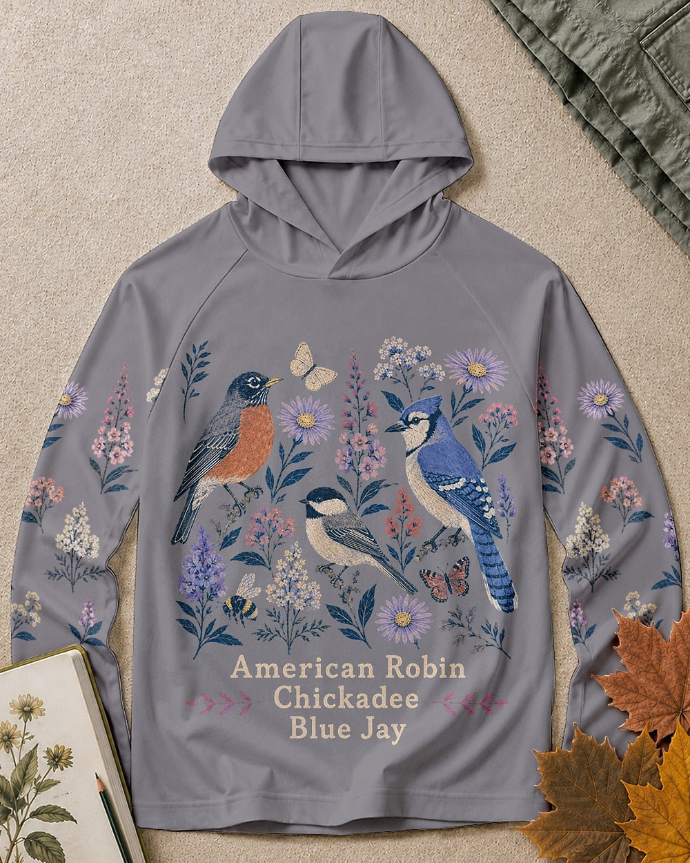 Women's gray sun hoodie with robins, chickadees, blue jays and wildflowers, front view.
