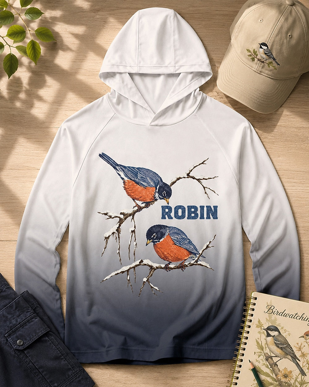 Women's white navy ombre sun hoodie with two robins on bare branches, front view.