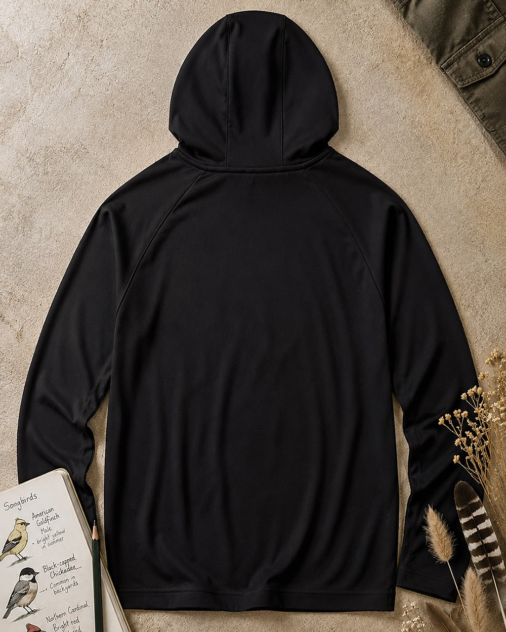 Back view of the women's black sun hoodie, showing the hood and long sleeves.