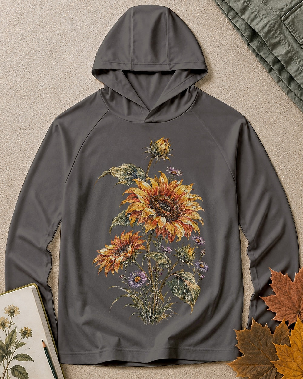 Women's dark grey sun hoodie with sunflowers and purple asters, front view.