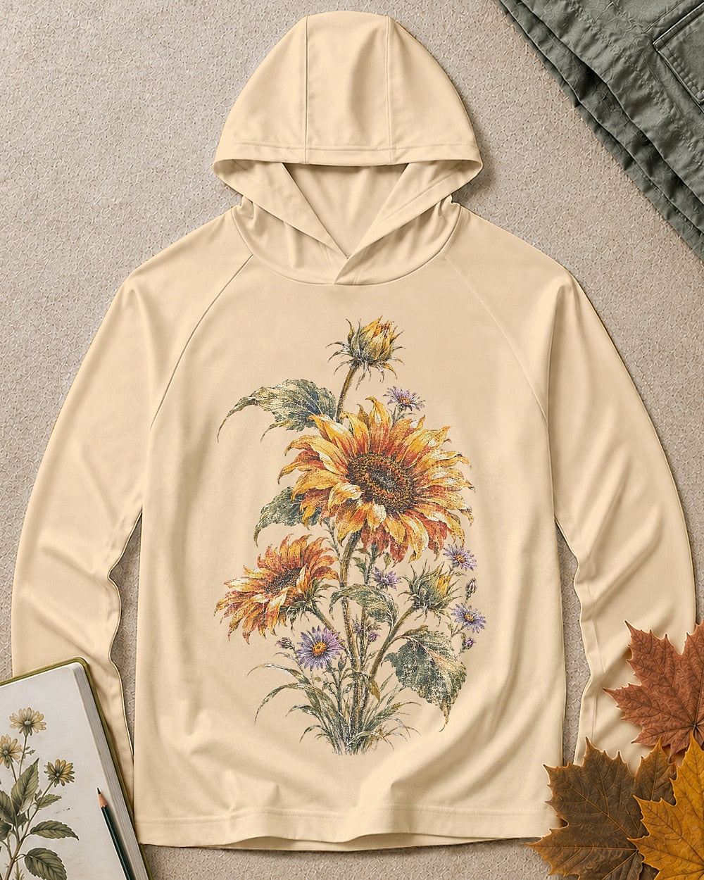 Women's light yellow sun hoodie with sunflowers and purple asters, front view.