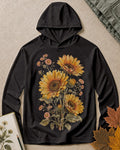 Women's black sun hoodie with sunflowers and daisies, front view.