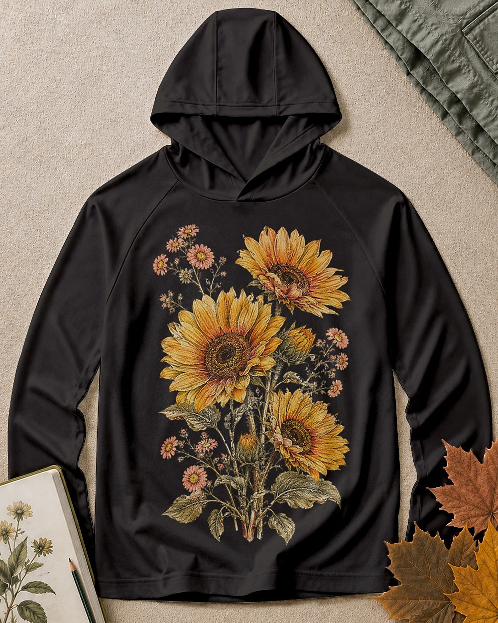 Women's black sun hoodie with sunflowers and daisies, front view.