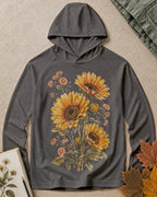 Women's dark grey sun hoodie with sunflowers and daisies, front view.