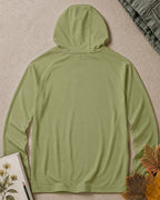 Back view of the women's green sun hoodie, showing the hood and long sleeves.