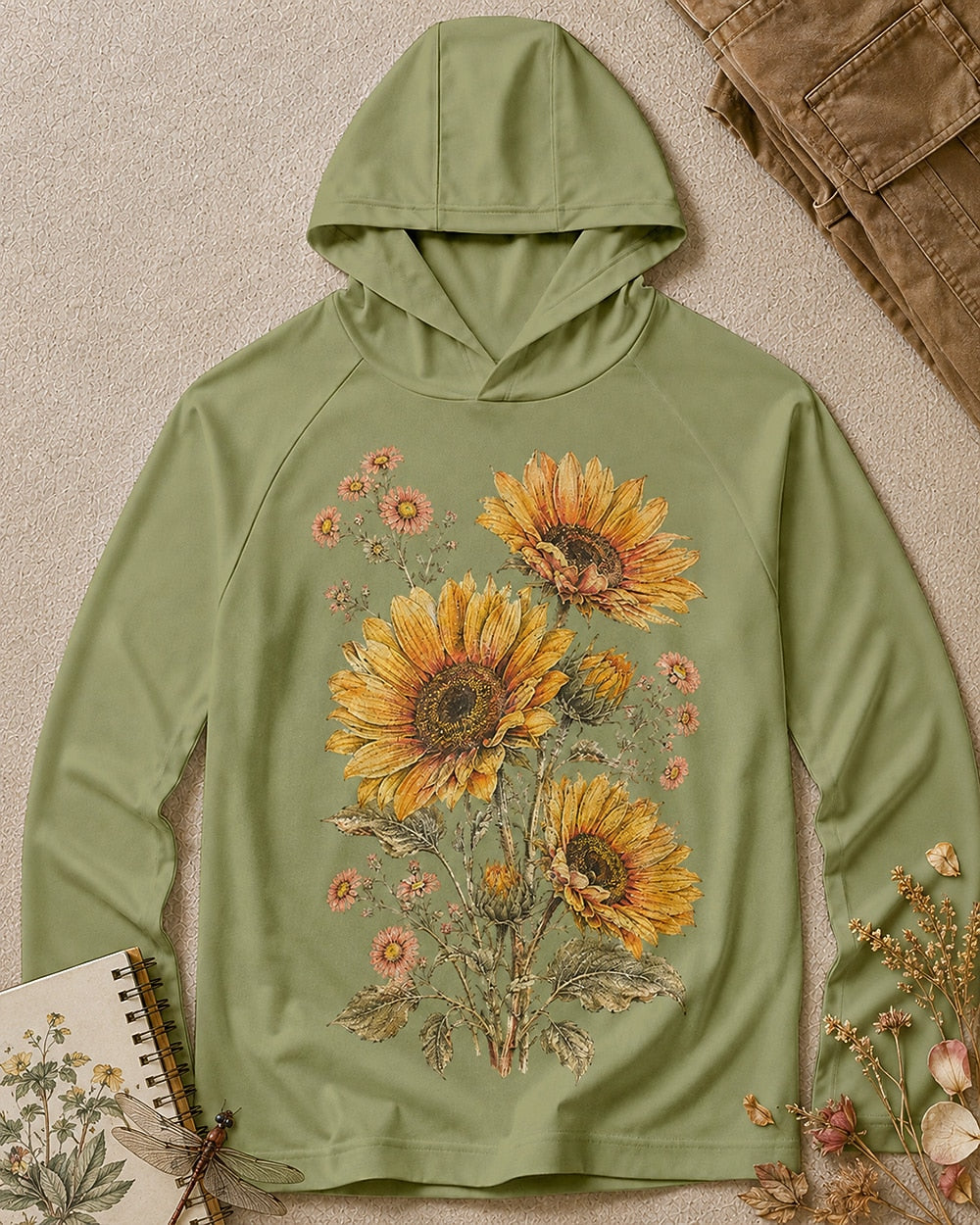 Women's green sun hoodie with sunflowers and daisies, front view.