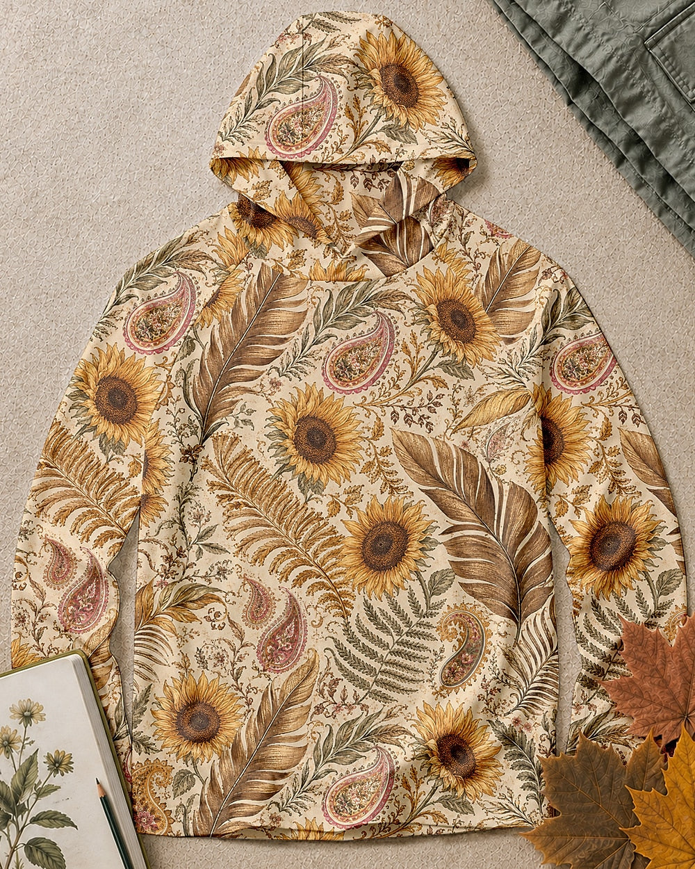 Women's yellow sun hoodie with an all-over sunflower and paisley pattern, front view.