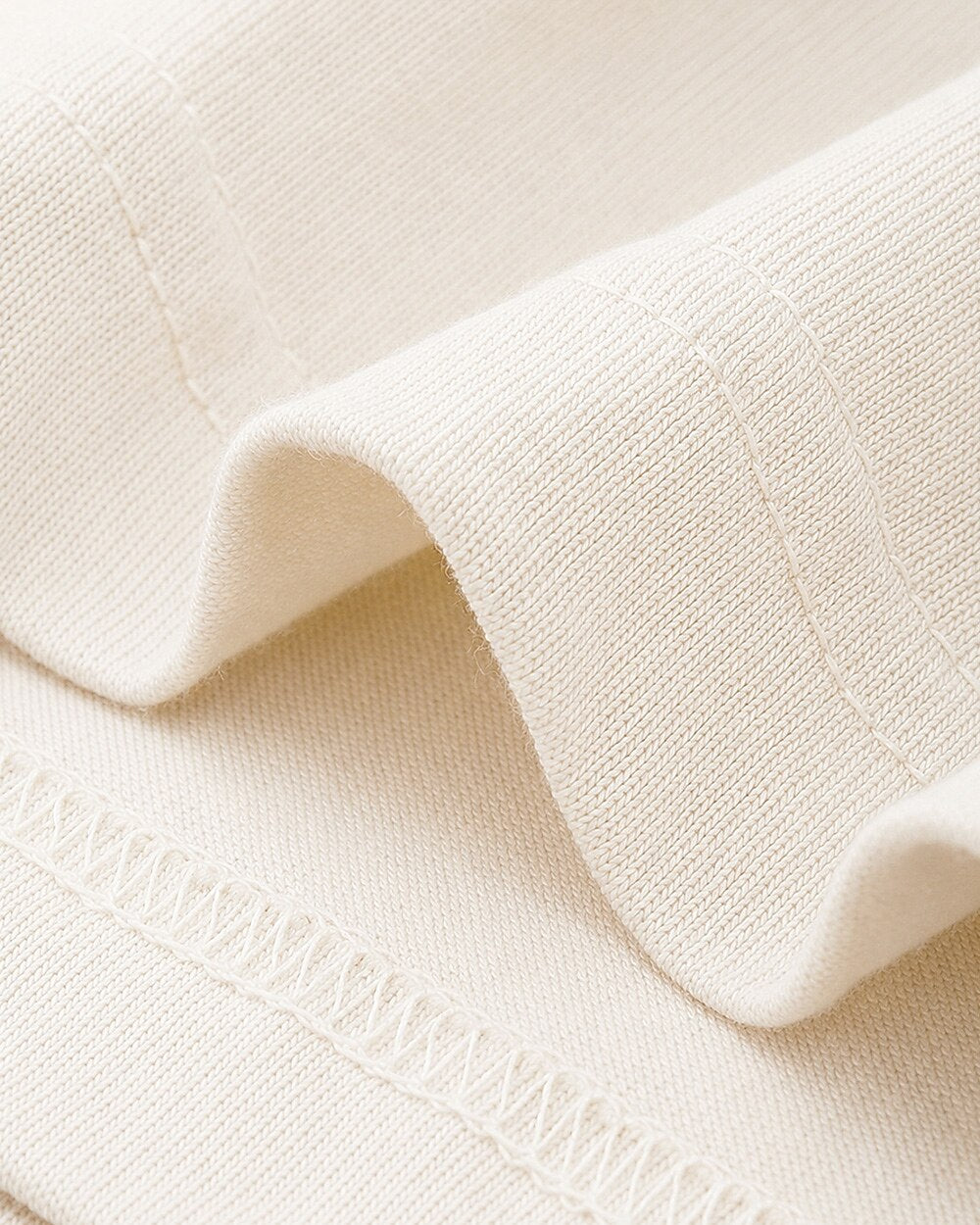 Cream fabric close-up for the women's sunflower rustic fence cotton T-shirt.