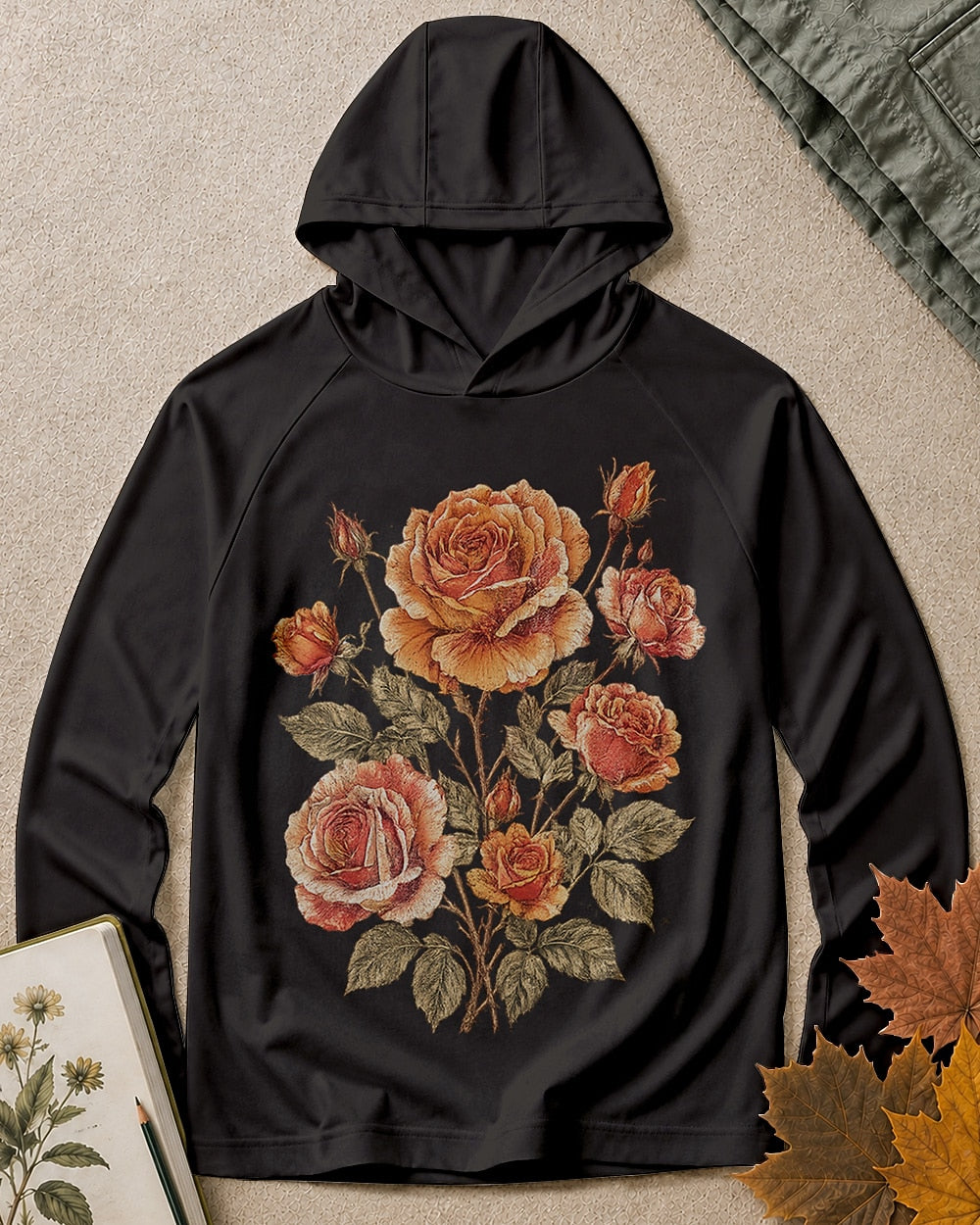 Women's black sun hoodie with vintage roses and leafy stems, front view.
