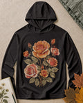 Women's black sun hoodie with vintage roses and leafy stems, front view.