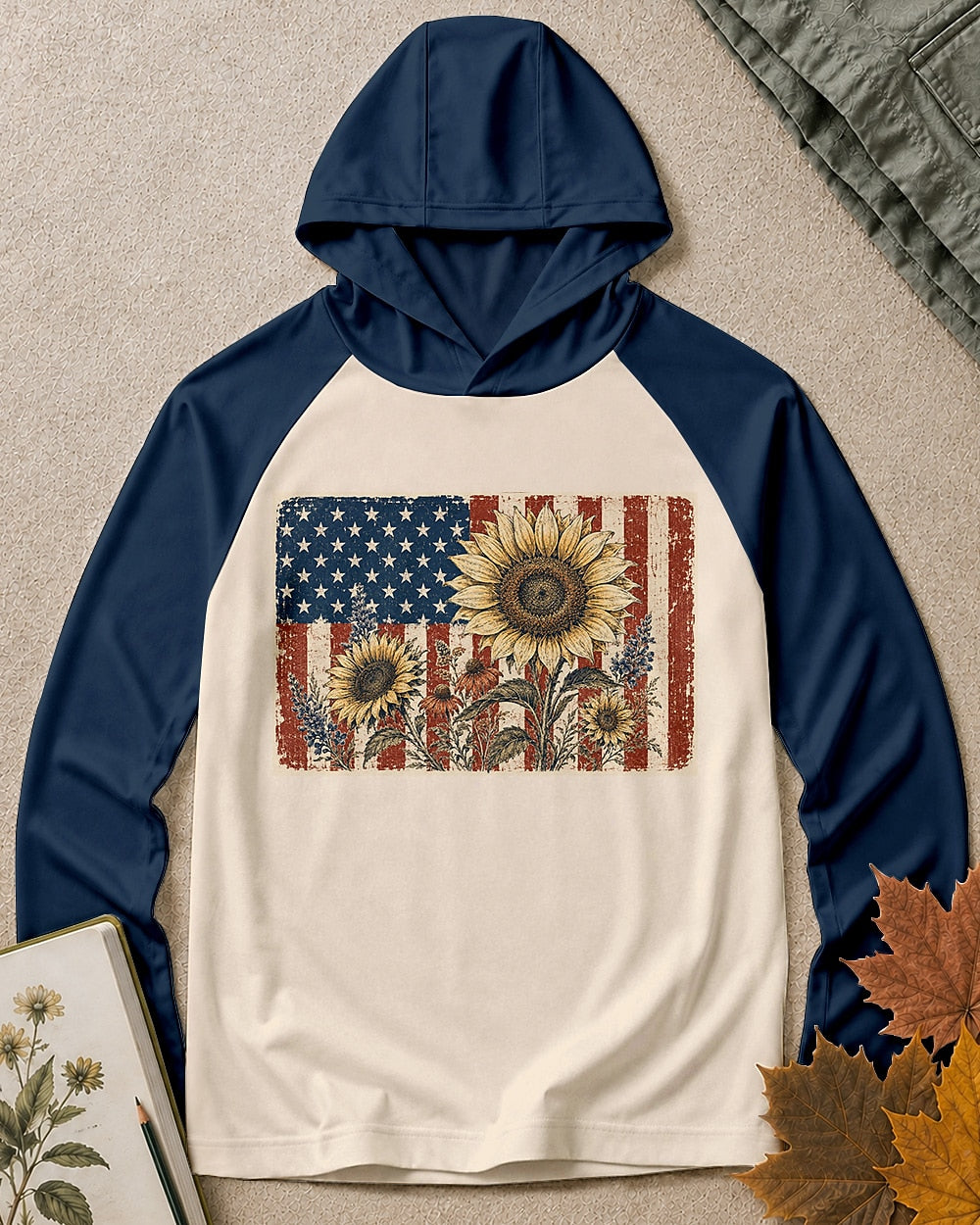 Women's navy cream sun hoodie with yellow sunflowers and an American flag, front view.
